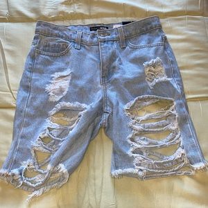 Fashionnova light denim ripped shorts.
